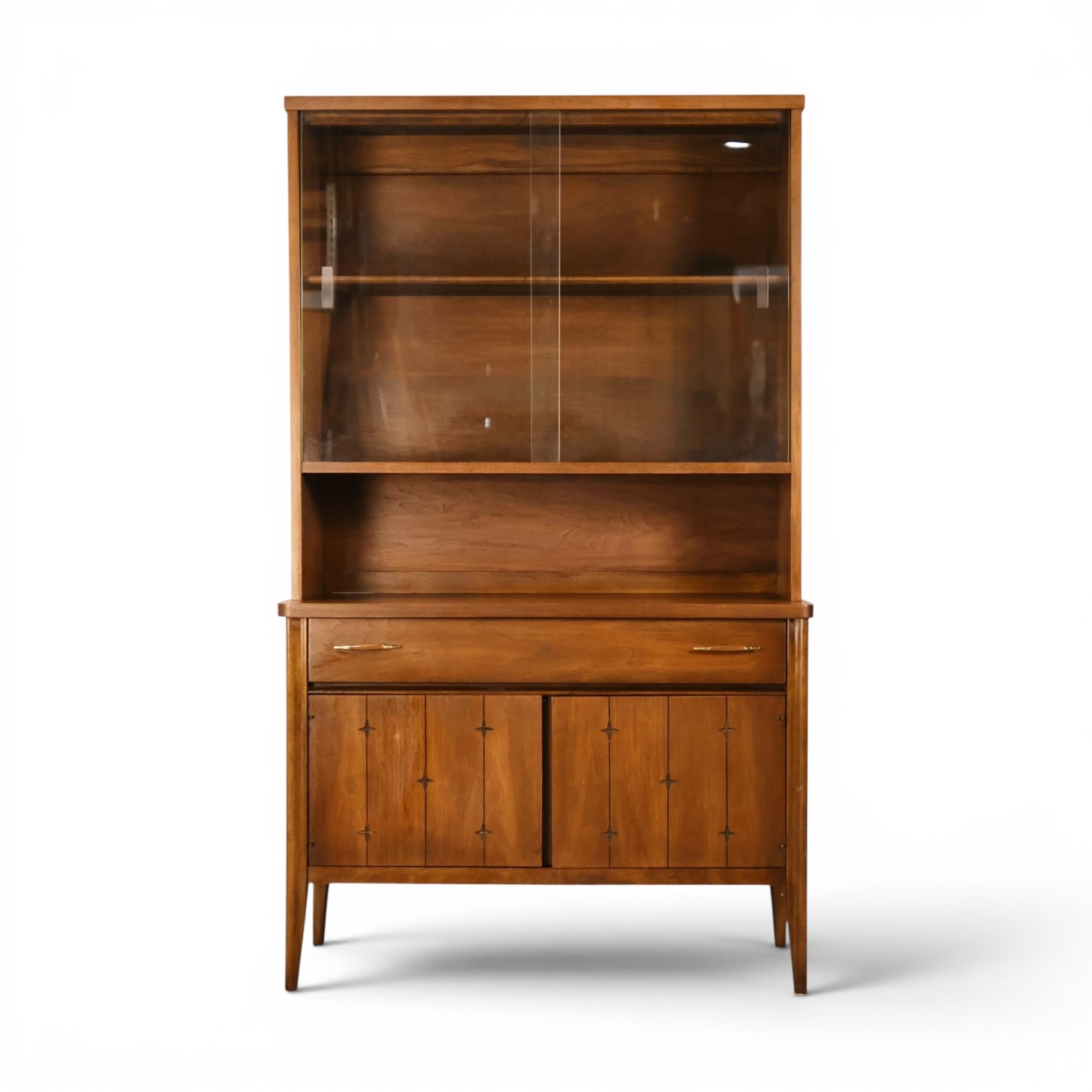 Broyhill Saga petite walnut china cabinet front view with sliding glass doors and star inlay base