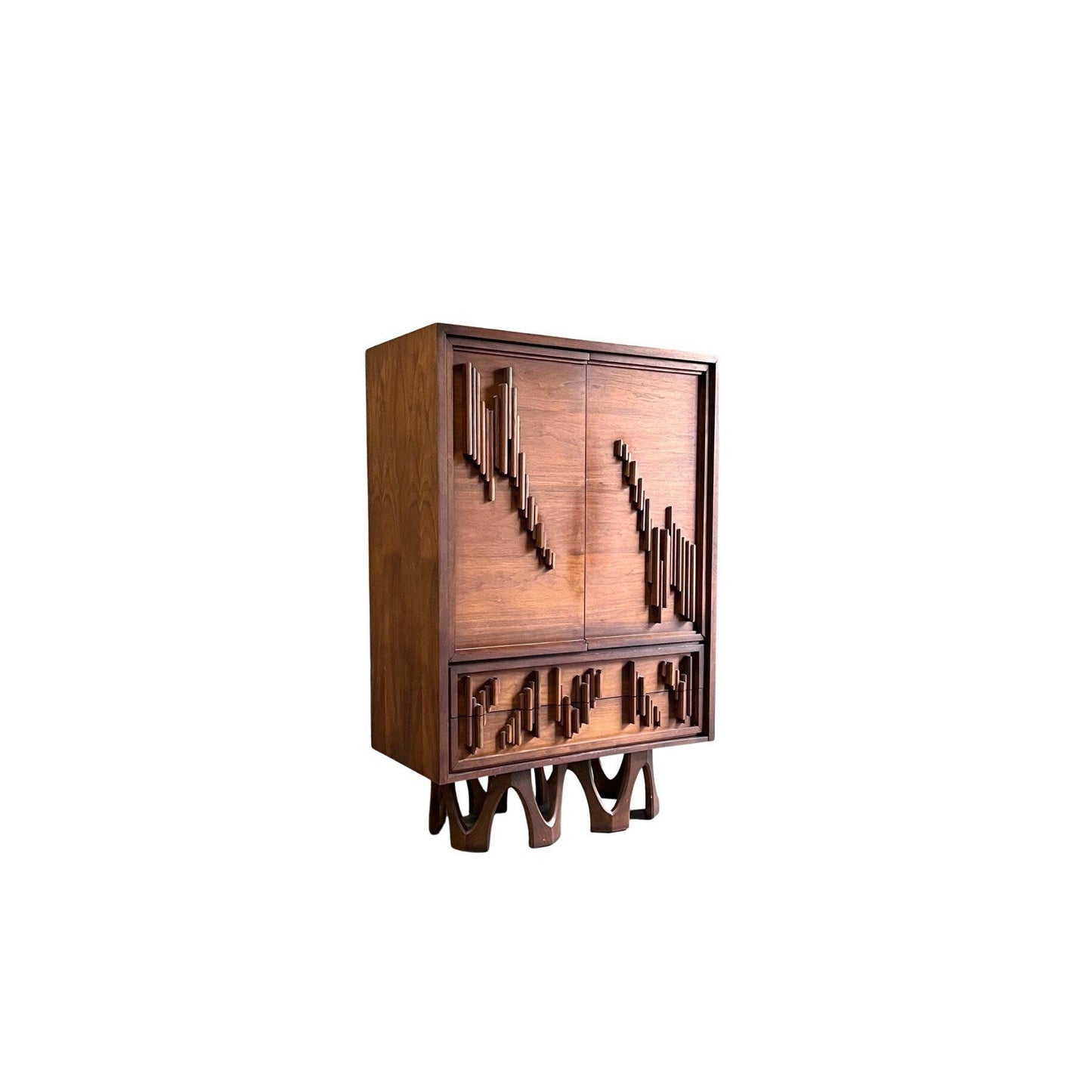 Brutalist style armoire crafted from rich walnut, showcasing unique 3D elements.