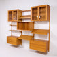 Poul Cadovius Cado System oak wall unit angled view with glass door cabinets and floating drawer cabinets
