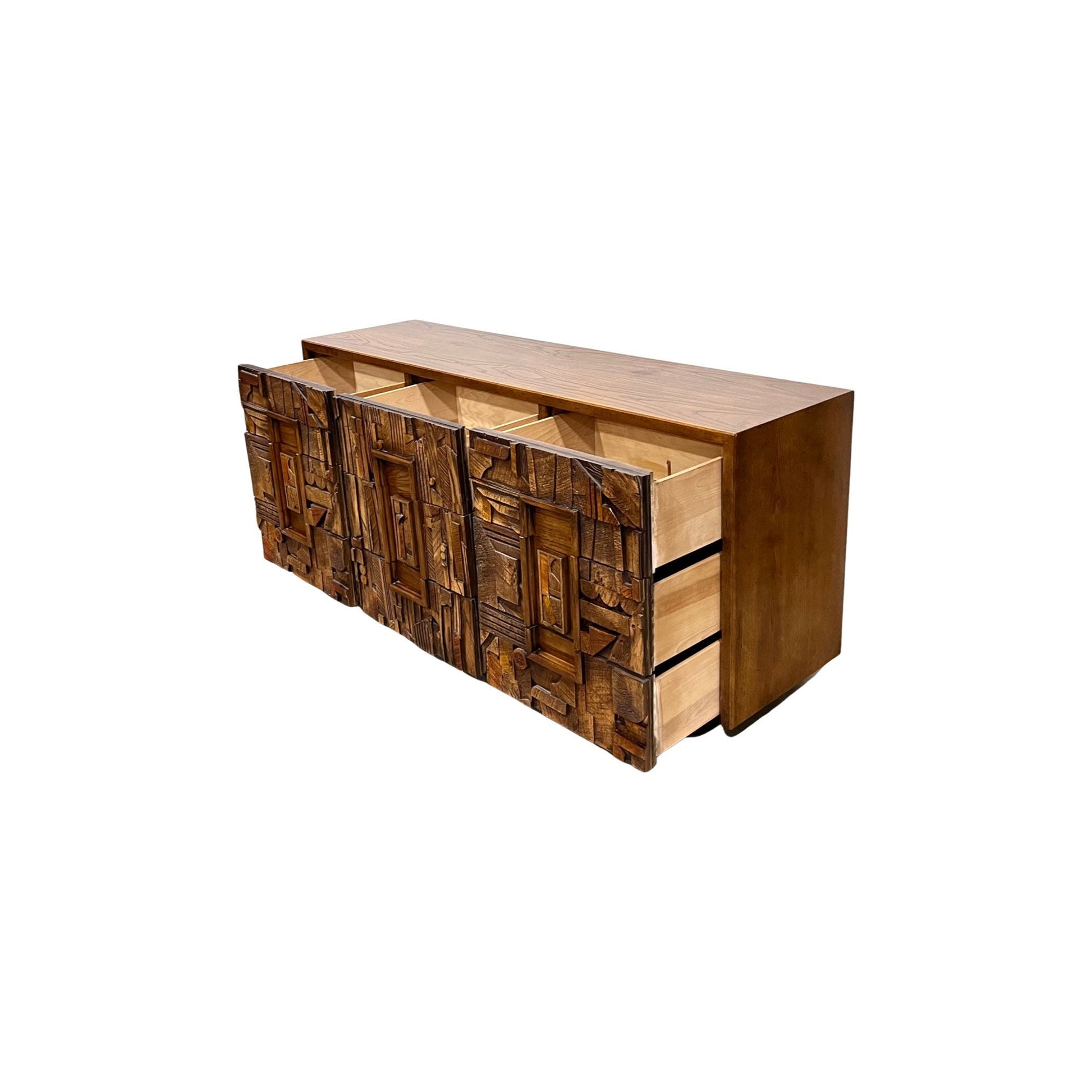 High-quality lowboy dresser with a distinctive southwestern-style brutalist pattern on all nine drawers, built to last with exceptional attention to detail and craftsmanship.
