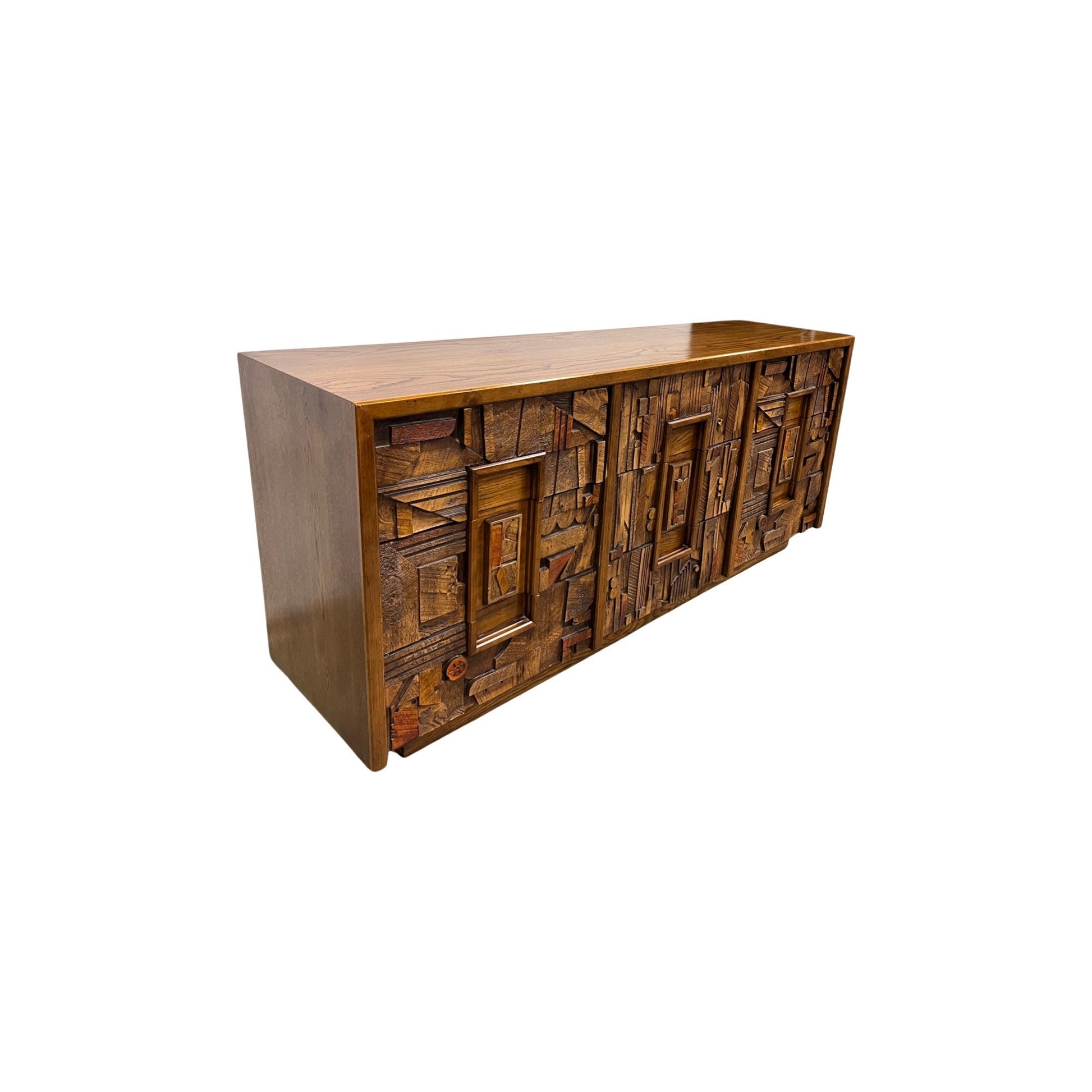Masterfully crafted lowboy dresser from Lane Furniture's Pueblo line inspired by renowned brutalist designer Paul Evans with intricate brutalist pattern on all nine drawers