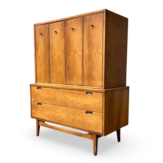 Walnut dresser with rich graining and splayed legs, showcasing traditional craftsmanship.